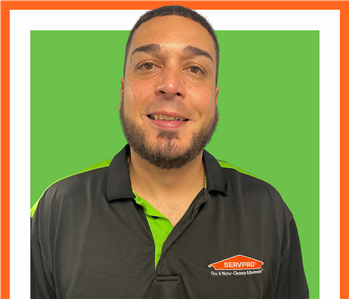 Joel, SERVPRO employee, cut out and set against a green backdrop