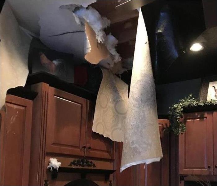 Ceiling fell out after water came in from the attic.