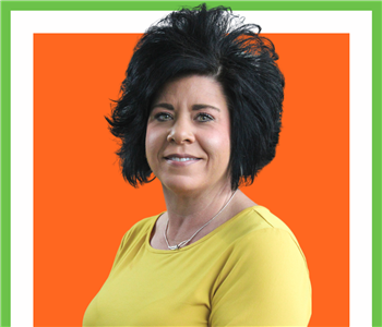 Christy, Female, employee, dark hair against orange background