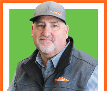 Jeff Williams for SERVPRO photo on white wall